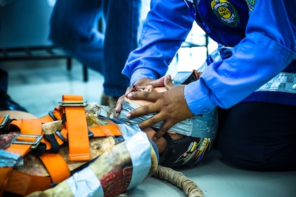 Joint Security Forces and local police forces participate in Subject Matter Expert Exchange to practice life saving techniques for emergency situations.