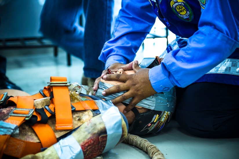 Joint Security Forces and local police forces participate in Subject Matter Expert Exchange to practice life saving techniques for emergency situations.