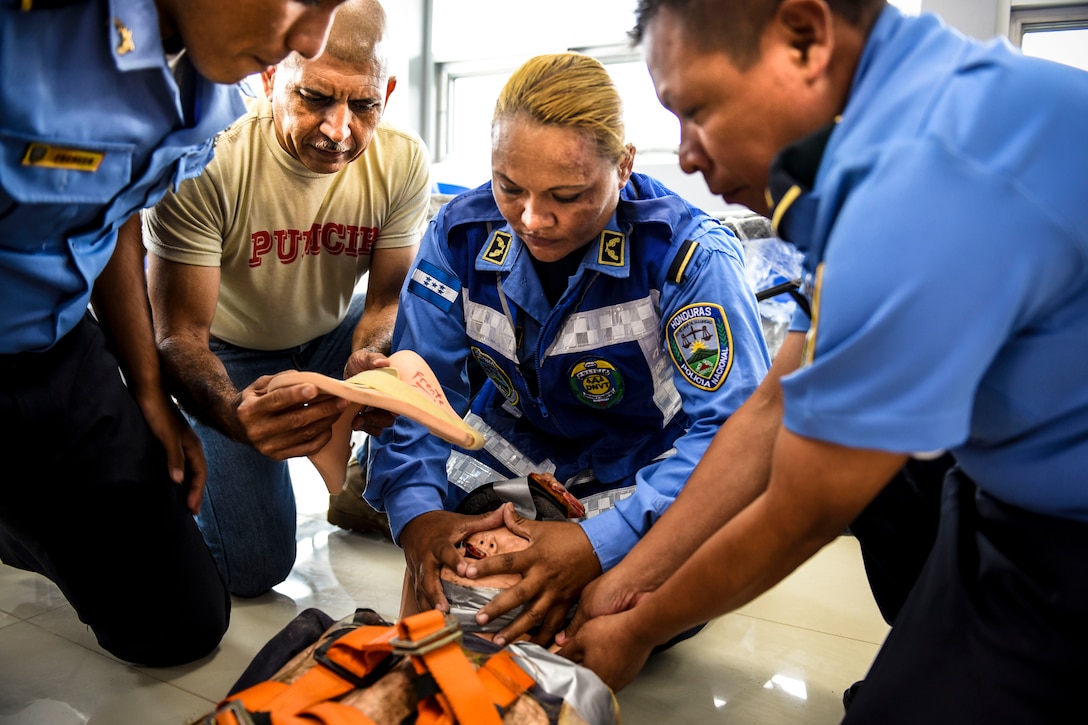 Joint Security Forces and local police forces participate in Subject Matter Expert Exchange to practice life saving techniques for emergency situations.