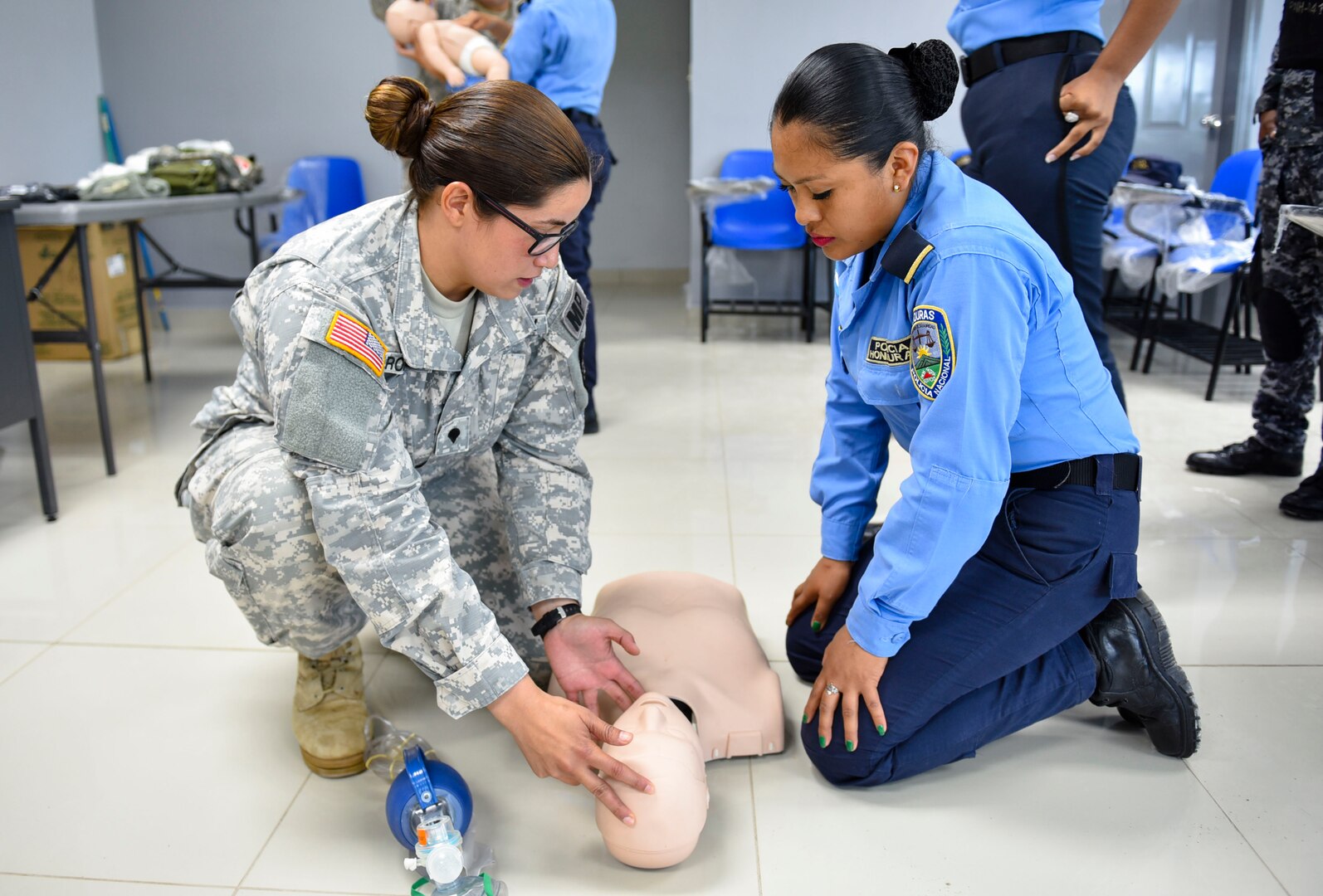 Joint Security Forces and local police forces participate in Subject Matter Expert Exchange to practice life saving techniques for emergency situations.