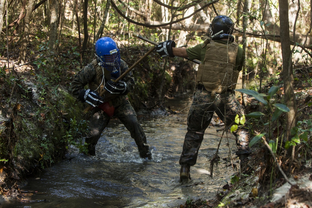 U.S. Marines with the Battalion Landing Team 2nd Battalion, 6th Marine Regiment, 26th Marine Expeditionary Unit (MEU), fight in a creek during a Martial Arts Instructor Course (MAIC) at Marine Corps Base Camp Lejeune, N.C., Oct. 26, 2017.