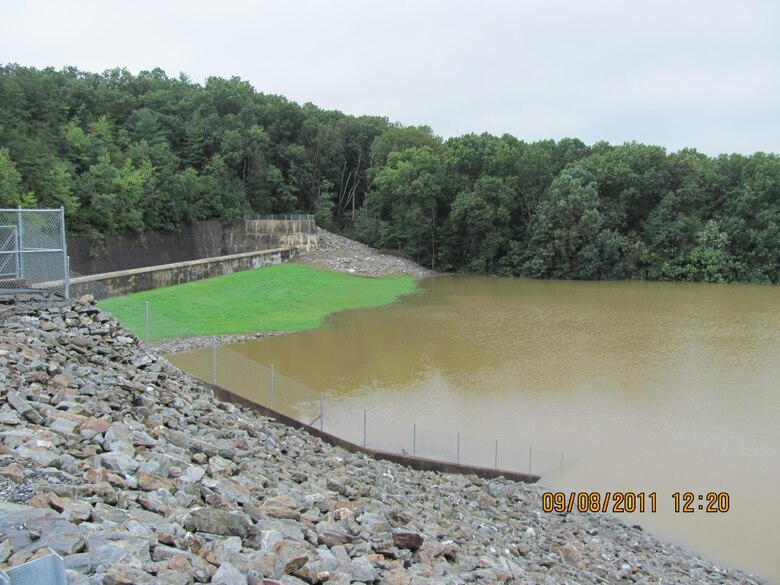 Waters from Tropical Storm Lee are seen here in the normally dry reservoir behind Indian Rock Dam September 8, 2011. To the left is the dam’s concrete overflow spillway. The water in the reservoir peaked at 44.1 percent capacity during Tropical Storm Lee. Had the reservoir’s capacity been exceeded, water would have flowed into the concrete spillway and made its way downstream so as to not risk putting too much pressure on the dam. Tropical Storm Lee caused devastating flooding in parts of Pennsylvania and other states, but in York its impacts were greatly reduced by Indian Rock Dam.