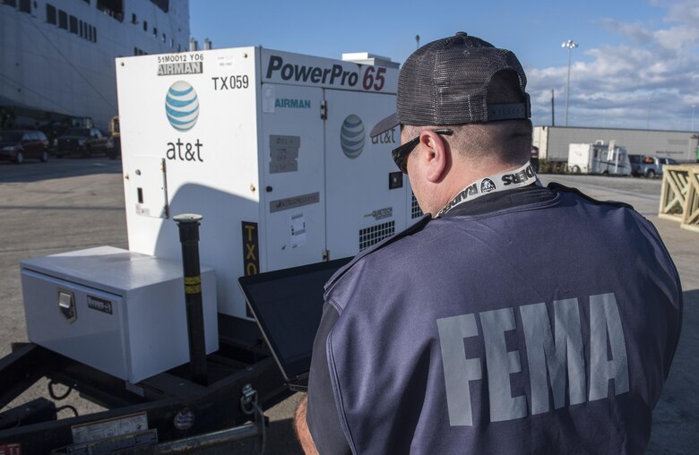 Douglas Kahn, Federal Emergency Management logistics planner inventories items as they are loaded onto USNS Brittin (T-AKR-305) Oct. 28, 2017, at the Joint Base Charleston Weapons Station, S.C.