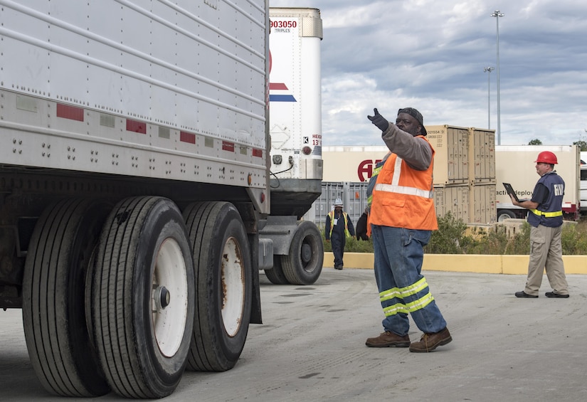 Longshoremen directs a truck onto the USNS Brittin (T-AKR-305) Oct. 29, 2017, at Joint Base Charleston-Weapons Station, S.C.