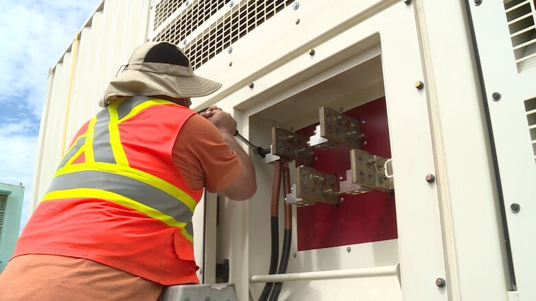 U.S. Army Corps of Engineers contractor Installs cables that run from the generator to the transformer. The generator was installed at the Barceloneta Water Treatment Plant which provides water to a large number of factories in the area. With power restored, factory workers will be able to return to work