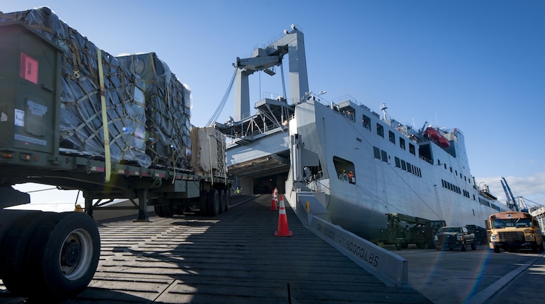 Cargo is driven onto the USNS Brittin (T-AKR-305) by a flatbed truck on the Joint Base Charleston Naval Weapons Station Oct. 28, 2017.
