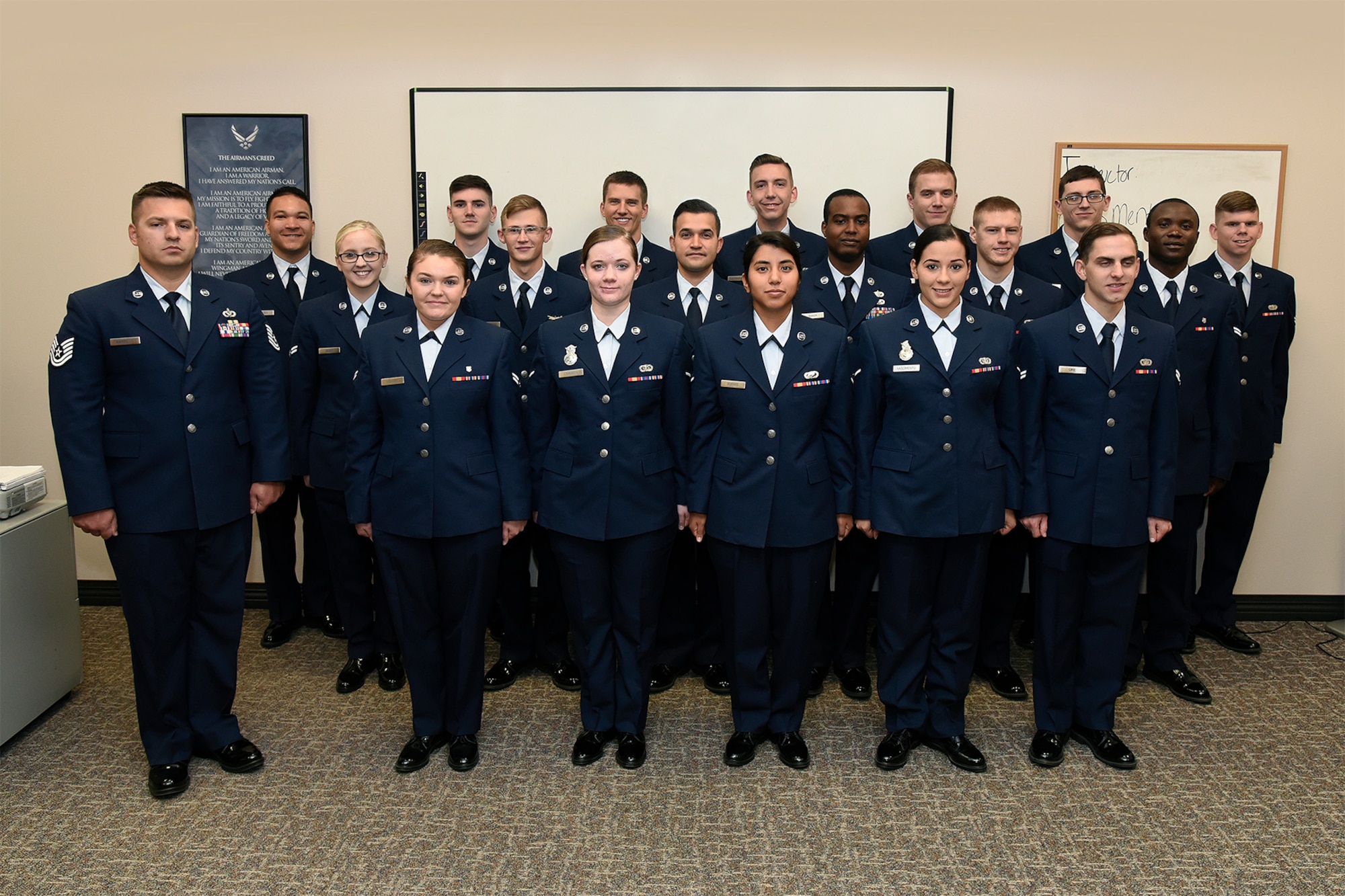 Airman from class 18-1 stand at attention during training at the First Term Airman’s Center October 24, 2017, Peterson Air Force Base, Colorado. The purpose of FTAC is to prepare first term Airman to enter the operational Air Force as a productive member of the team. Training lasts five days and consists of various subjects such as resiliency training, supervisor and Airman scenarios, core values, and financial guidance.  
(U.S. Air Force Photo by Craig Denton)