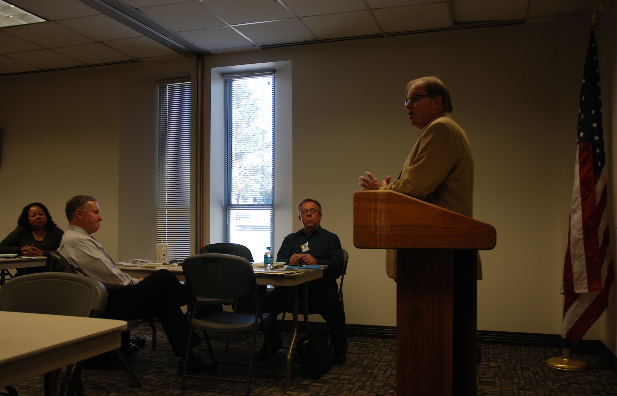 Bob Kittridge, right, Toastmasters area director, addresses Peterson Toastmasters club members Bob Laborde, center, and Mike Pierson, Air Force Space Command community outreach chief, during their recognition as Distinguished Toastmasters on Oct. 24, 2017, at Peterson Air Force Base, Colorado. The DTM is the highest educational award in the organization. (U.S. Air Force photo by Dave Smith)