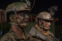 U.S. Marine Corps Lance Cpl. Jadon Valdez, left, a rifleman, and HM3 Cody Moody, right, a hospital corpsman, both with 1st Light Armored Reconnaissance Battalion, 1st Marine Division prepare for a night insert to an observation post during Exercise Southern Katipo 17 (SK17) at St. Arnaud, New Zealand, Oct. 24, 2017.