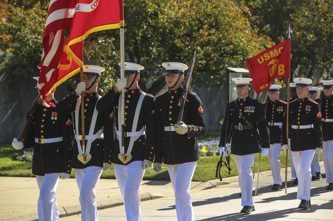 The U.S. Marine Corps Color Guard marches with the National and Marine Corps Colors through Arlington National Cemetery during a full honors funeral for Maj. Gen. Terrence R. Murray at ANC, Arlington, Va., Oct. 31, 2017. Marine Barracks Washington is home to the Marines who provide support for all Marine Corps funerals and many high-ranking government officials’ funerals within the National Capitol Region. (Official U.S. Marine Corps photo by Cpl. Damon Mclean/Released)