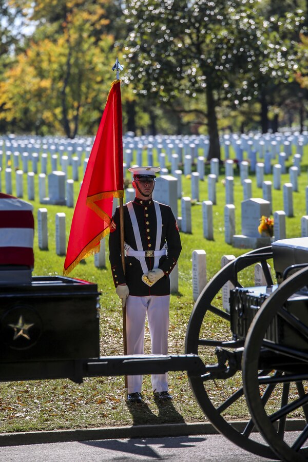 A Marine with the U.S. Marine Corps Color Guard presents a general officer flag during a full honors funeral for Maj. Gen. Terrence R. Murray at Arlington National Cemetery, Arlington, Va., Oct. 31, 2017. Marine Barracks Washington is home to the Marines who provide support for all Marine Corps funerals and many high-ranking government officials’ funerals within the National Capitol Region. (Official U.S. Marine Corps photo by Cpl. Damon Mclean/Released)