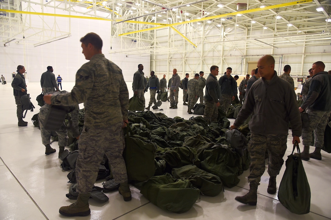 Airmen collect equipment during a training session.
