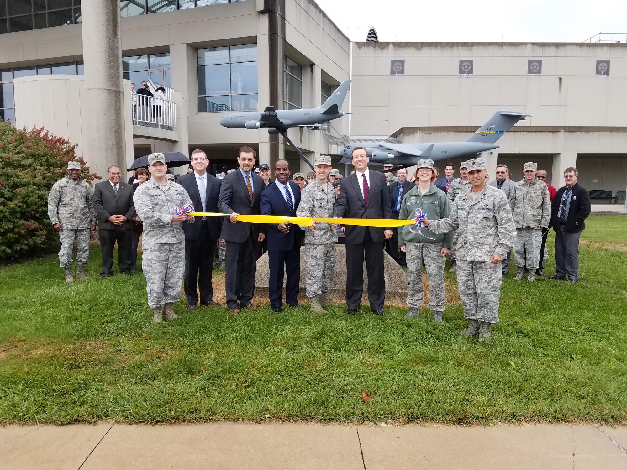 Members of the Tanker and Mobility Directorates held a joint ribbon cutting ceremony Oct. 24 to unveil a model KC-46 simulating the refueling of a C-17 model. The model aircraft was donated by the Boeing Company. (U.S. Air Force photo / Brian Brackens)
