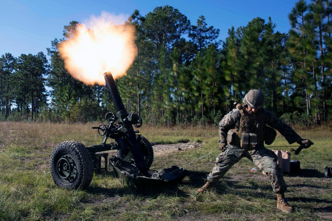A Marine fires a mortar.