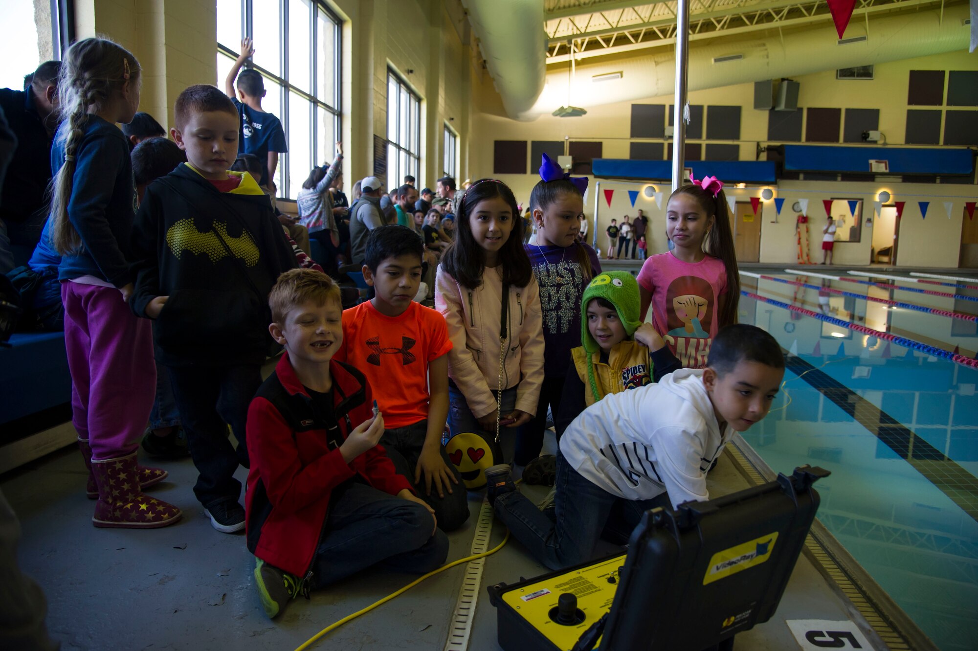 Attendees at Laughlin’s first robot rodeo operate the U.S. Customs and Border Patrol underwater robot during cyber awareness week at Laughlin Air Force Base, Texas, Oct. 28, 2017. The robots featured at the rodeo varied from prebuilt creations to explosive ordinance disposal robots from the U.S. Customs and Border Patrol.