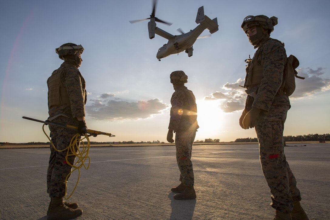 Landing Support Specialists with Special Purpose Marine Air-Ground Task Force-Crisis Response-Africa, conduct helicopter support team drills with an MV-22B Osprey at Morón Air Base, Spain, Oct. 4, 2017. SPMAGTF-CR-AF deployed to conduct limited crises-response and theatre-security operation in Europe and North Africa. (U.S. Marine Corps photo by Sgt. Takoune H. Norasingh)