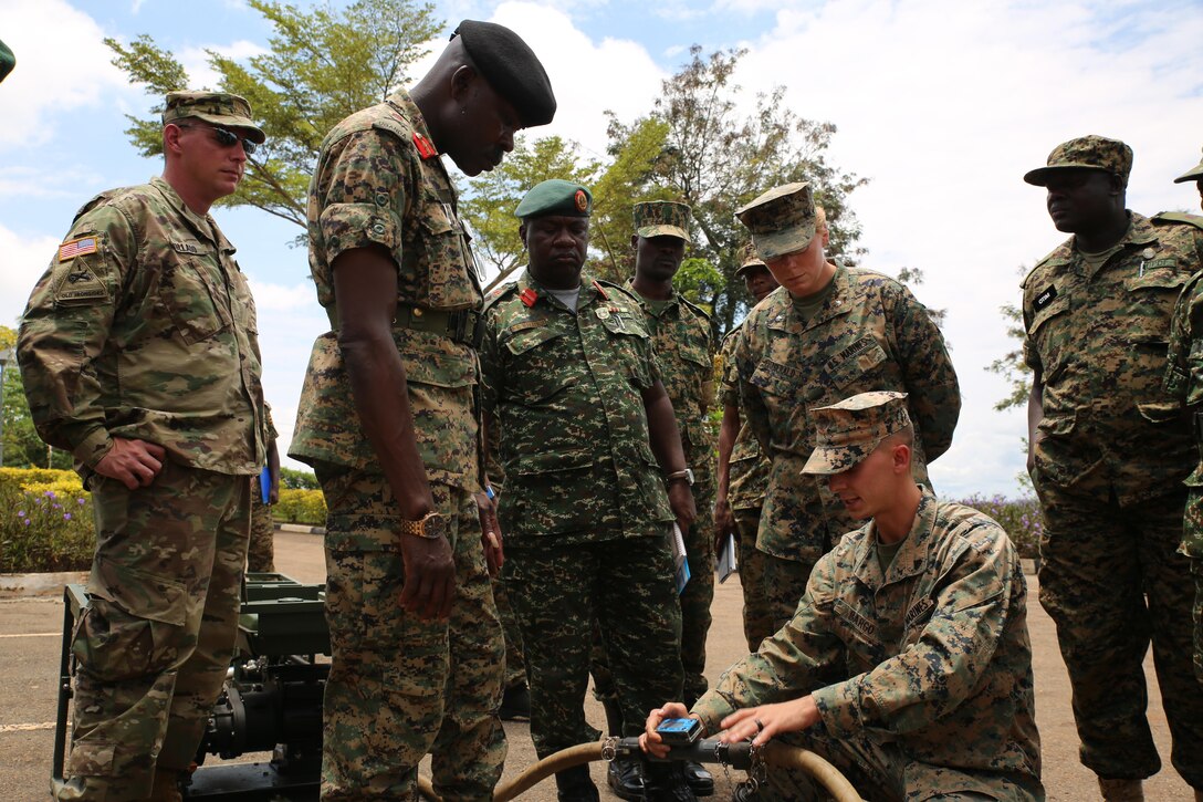 A U.S. Marine assigned to Special Purpose Marine Air-Ground Task Force Crisis Response-Africa logistics combat element host a static display after the graduation ceremony at Camp Jinja, Uganda, Oct. 13, 2017. SPMAGTF-CR-AF LCE service members facilitated an eight-week training mission in Uganda. SPMAGTF-CR-AF Marines deployed to conduct crisis-response and theater-security operations in Europe and Africa.  (U.S. Marine Corps Photo by Lance Cpl. Patrick Osino)