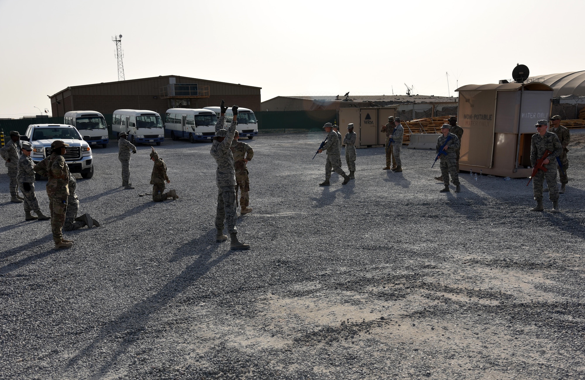 Airmen practice challenging procedure on each other near the 407th Expeditionary Security Forces Squadron on the 407th Air Expeditionary Group Oct. 30. The individuals of this class mark the 300th augmentee trained by security forces. (U.S. Air Force photo by Staff Sgt. Joshua Edwards/Released)