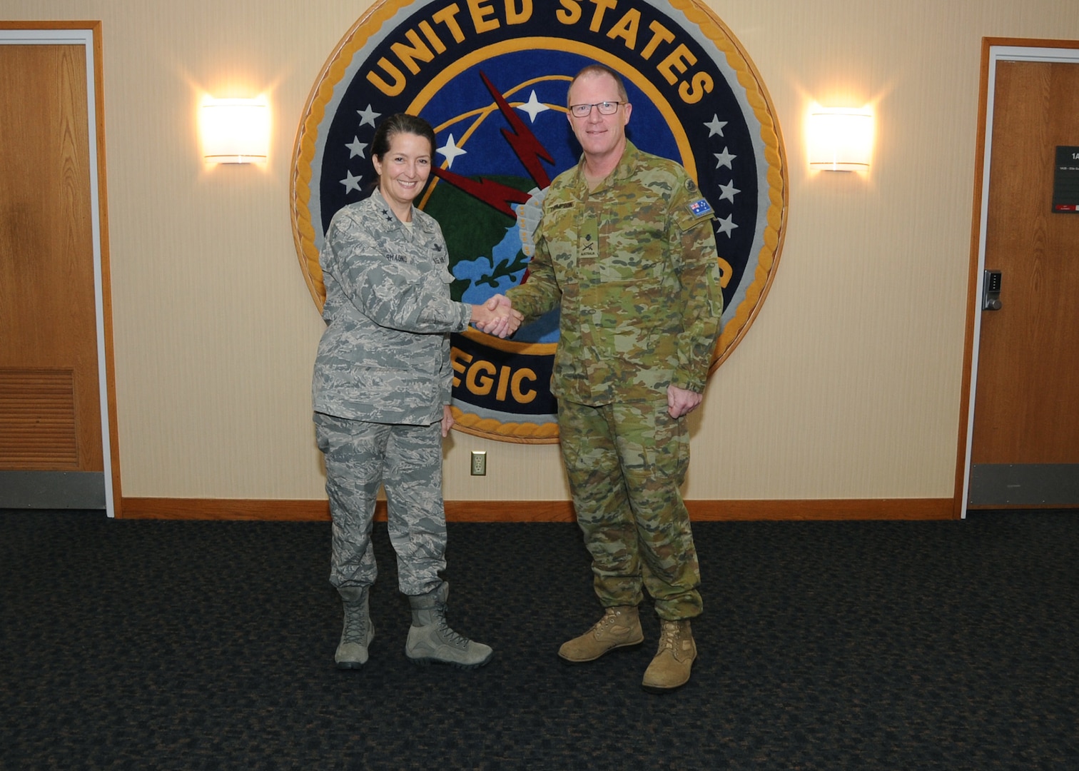 U.S. Air Force Maj. Gen. Nina Armagno, director of plans and policy for U.S. Strategic Command (USSTRATCOM), welcomes Australian Army Maj. Gen. Marcus Thompson, Deputy Chief Information Warfare for the Australian Defence Force, to USSTRATCOM headquarters at Offutt Air Force Base, Neb., Oct. 27, 2017. During his visit, Thompson met with senior leaders and subject matter experts for discussions on areas of collaboration and USSTRATCOM’s missions. One of nine Department of Defense unified combatant commands, USSTRATCOM has global responsibilities assigned through the Unified Command Plan that include strategic deterrence, space operations, cyberspace operations, joint electronic warfare, global strike, missile defense and intelligence.