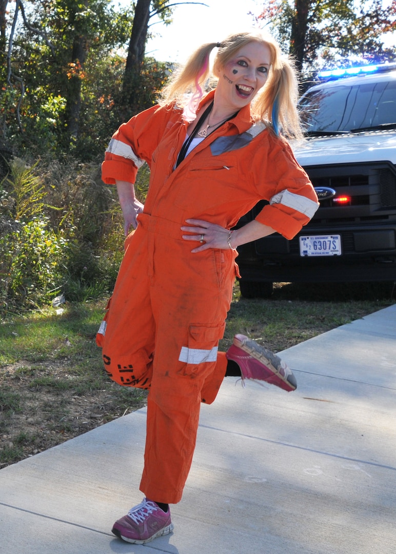 A woman poses for a photo dressed as the character Harley Quinn