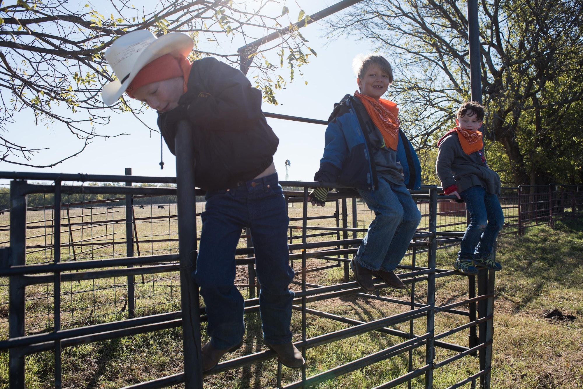 Children climb the fence of a horse pen while waiting for their next activity station at the 6th Annual Oklahoma National Guard Adjutant General’s Horseback Heroes event, Oct. 28, 2017, at Covey Creek Ranch in Oklahoma City. Horseback Heroes is conducted each fall for military children to show support to the families of Guardsmen, especially those who are deployed. (U.S. Air National Guard photo by Staff Sgt. Kasey M. Phipps/Released)