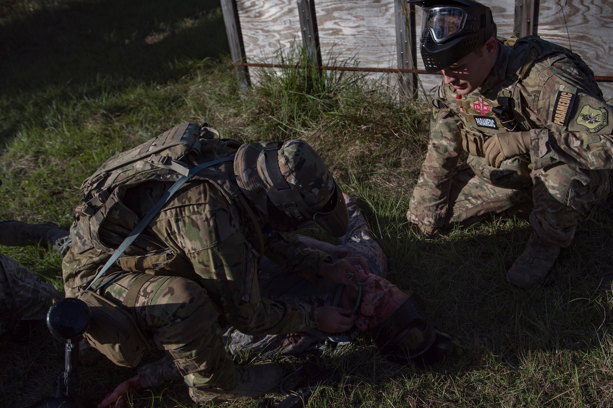 Staff Sgt. Cory Newby, 347th Operations Support Squadron Independent Duty Medical Technician paramedic, observes a student applying Tactical Combat Causality Care during training, Oct. 25, 2017, at Moody Air Force Base, Ga. The new, three-day combined training is designed to merge many smaller courses and seamlessly tie together skills that could be used in the event that Airmen become isolated during a mission. (U.S. Air Force photo by Senior Airman Daniel Snider)