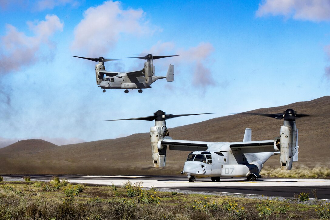 Marine Corps MV-22b Osprey aircraft land to pick up Marines during Exercise Bougainville II at Landing Zone Boondocker, Marine Corps Base Hawaii.