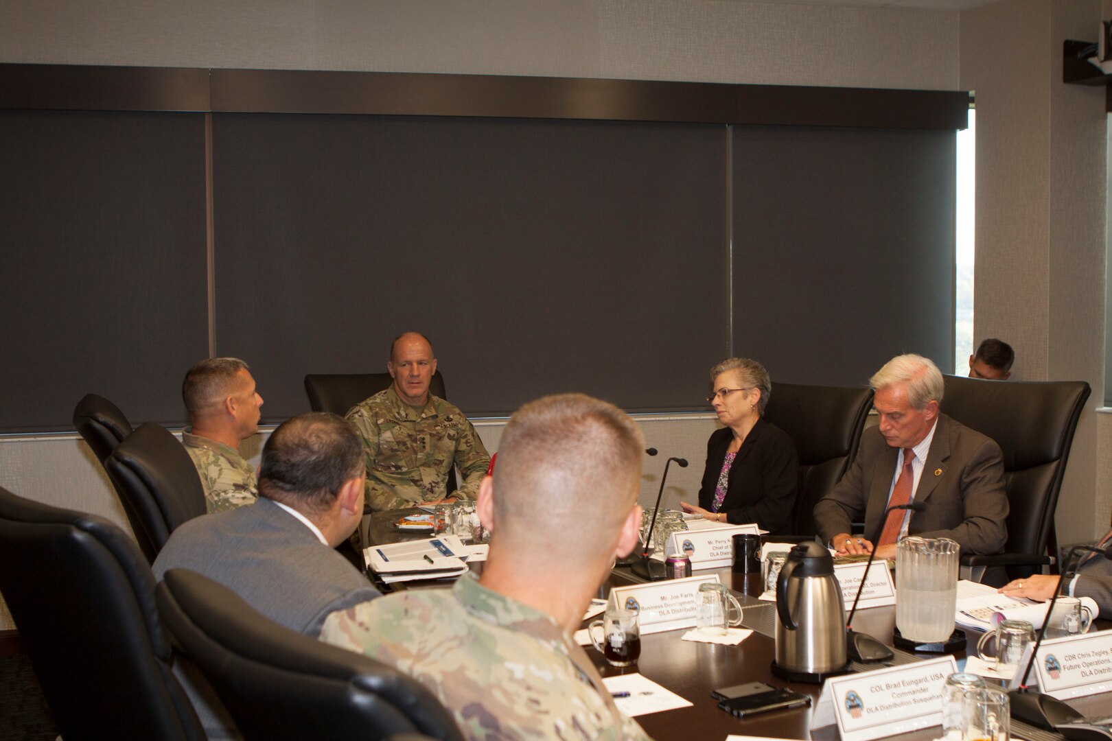 DLA Distribution commanding general Army Brig. Gen. John S. Laskodi, top left, leads a discussion on modernization with Army Lt. Gen.  Stephen Lyons, director of Logistics, J4, Joint Chiefs of Staff, center.