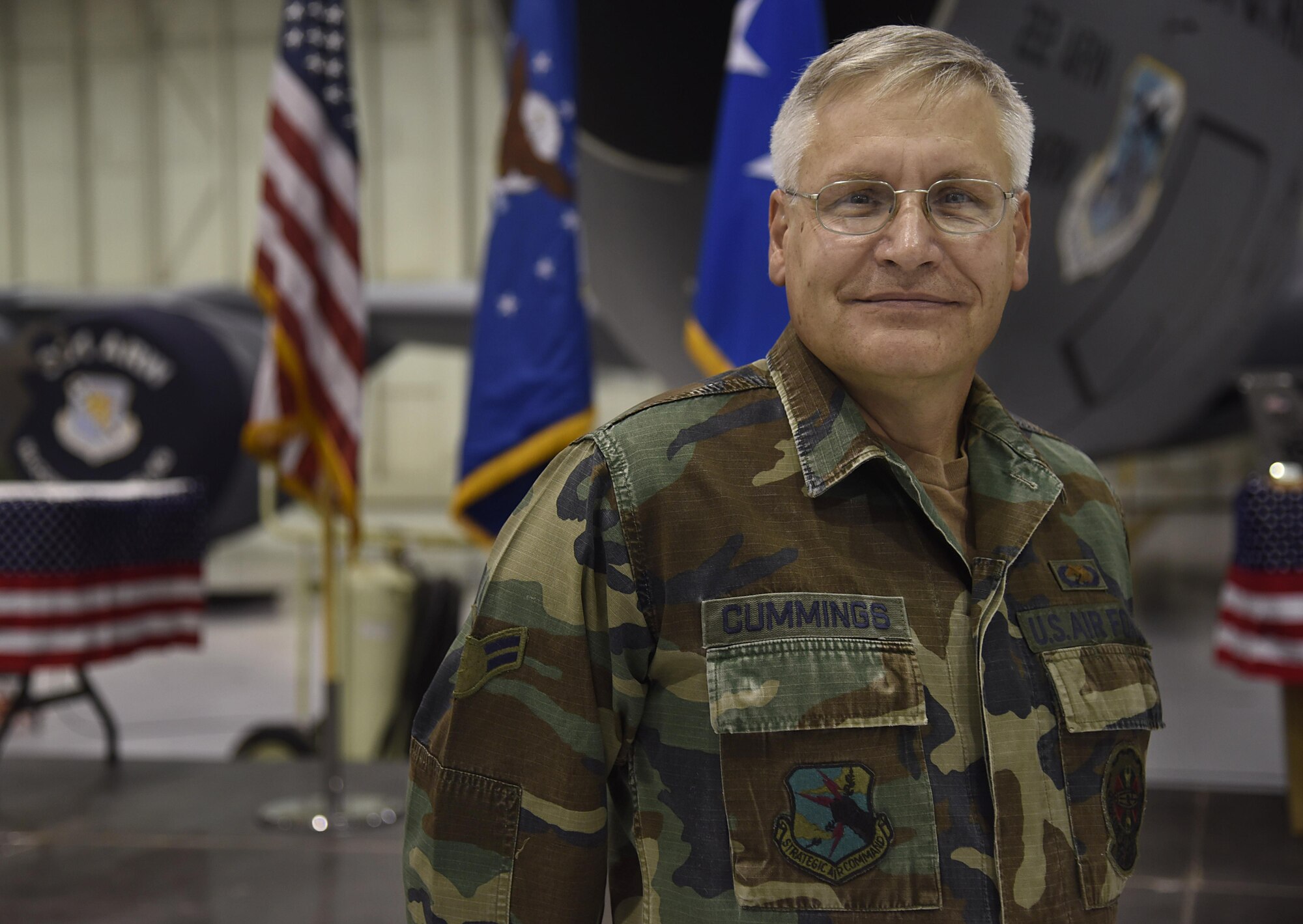 Chief Master Sgt. John Cummings, 22nd Maintenance Squadron Superintendent, poses for a photo while wearing an old uniform at the Knucklebusters banquet Oct. 14, 2017, at McConnell Air Force Base, Kansas. This year’s event was “throwback”-themed, encouraging attendees to wear old uniforms from throughout their careers. (U.S. Air Force photo by Airman 1st Class Erin McClellan)