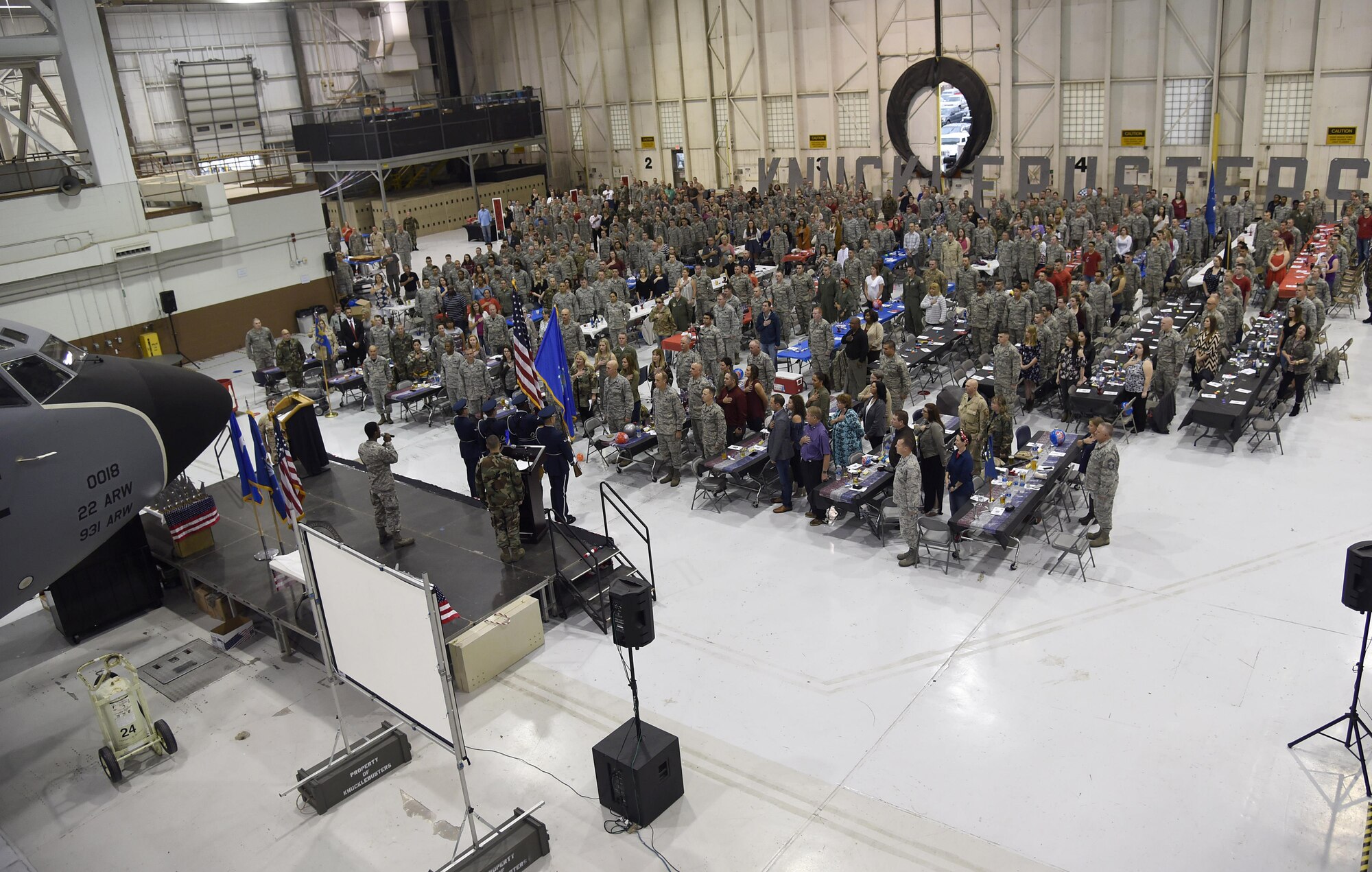 Banquet attendees stand for the signing of the national anthem at the beginning of the Knucklebusters banquet Oct. 14, 2017, at McConnell Air Force Base, Kansas. This year’s banquet was the 36th year McConnell has held the event. (U.S. Air Force photo by Airman 1st Class Erin McClellan)