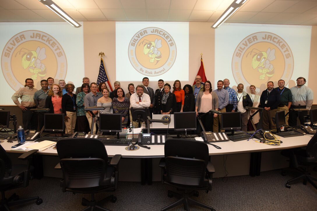 Federal, state and local partners pose for a group photo during the Tennessee Silver Jackets quarterly meeting at the Tennessee Emergency Management Agency Headquarters in Nashville, Tenn., Oct. 31, 2017. (USACE photo by Lee Roberts)