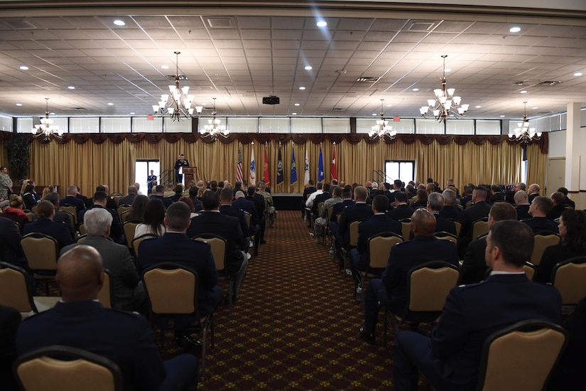 Leaders from organizations across Joint Base MDL are introduced to their new honorary commanders during the Honorary Commander Induction Ceremony here, Oct. 30, 2017. The Honorary Commander Program provides local community leaders an opportunity to experience military culture and view first-hand the many different missions across the installation; allowing them to return to their communities with insight into the inherent value of Joint Base MDL. (U.S. Air Force photo by Airman 1st Class Zachary Martyn)