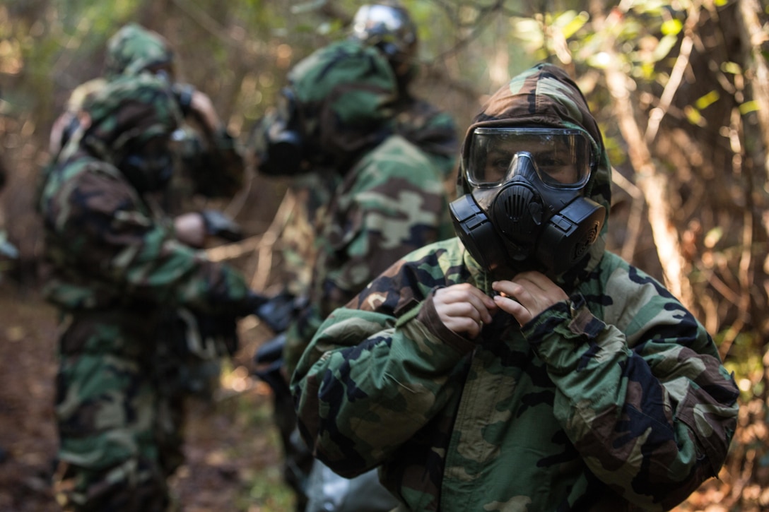 U.S. Marines with the 26th Marine Expeditionary Unit (MEU), don Mission Oriented Protective Posture gear during a chemical, biological, radiological, nuclear training event at Camp Lejeune, N.C., Oct. 30, 2017.