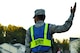 U.S. Air Force Airman 1st Class Emanuel Castro, 20th Logistics Readiness Squadron individual protective equipment apprentice and Pumpkin Patrol volunteer, directs traffic at Shaw Air Force Base, South Carolina, Oct. 31, 2017.