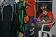 U.S. Air Force Maj. Kevin Weaver, 9th Air Force chief of standardization evaluation, greets trick-or-treaters while holding his son at Shaw Air Force Base, South Carolina, Oct. 31, 2017.