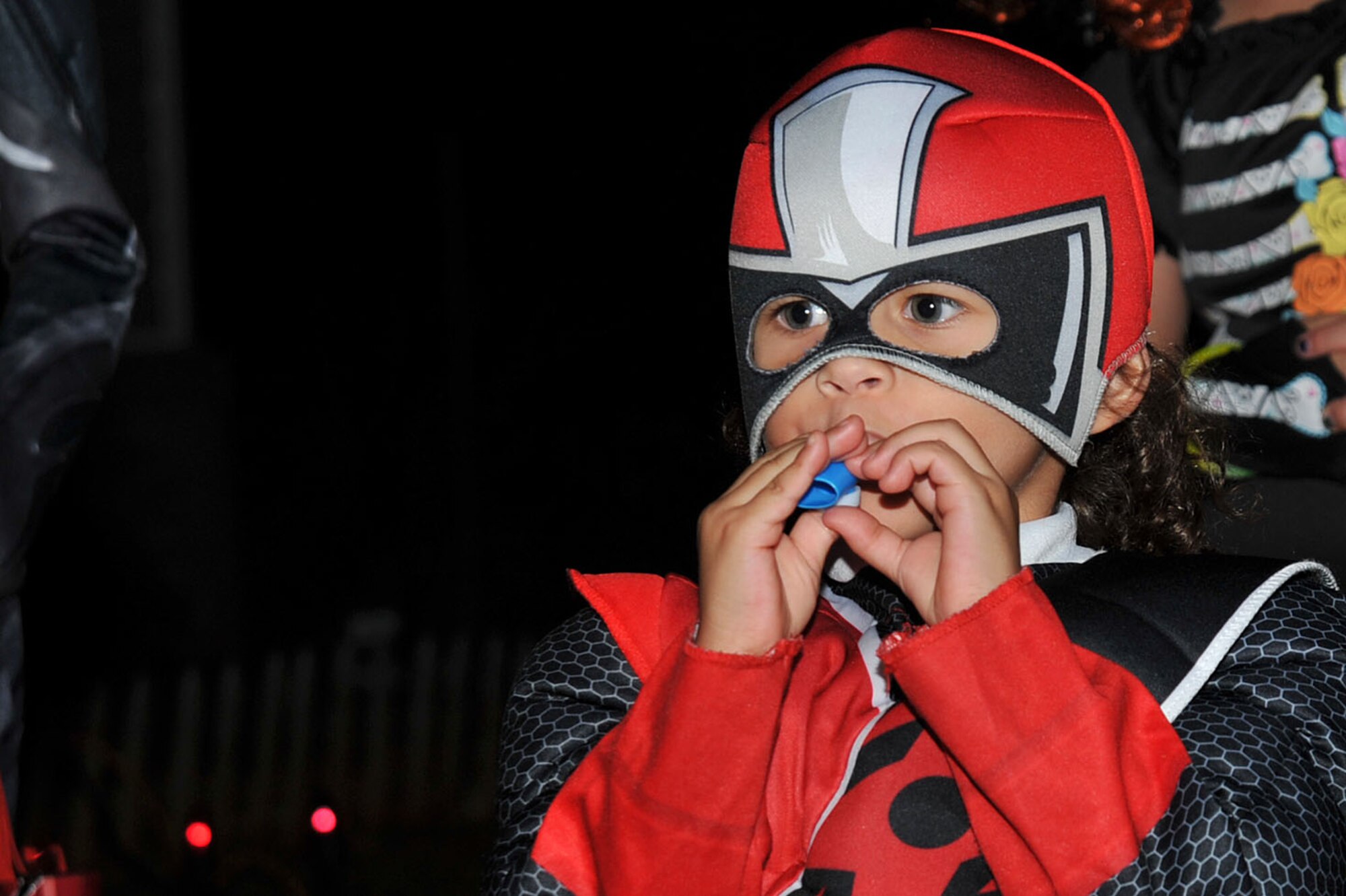 A Team Shaw child plays with a toy while trick-or-treating at Shaw Air Force Base, South Carolina, Oct. 31, 2017.