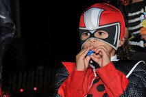 A Team Shaw child plays with a toy while trick-or-treating at Shaw Air Force Base, South Carolina, Oct. 31, 2017.