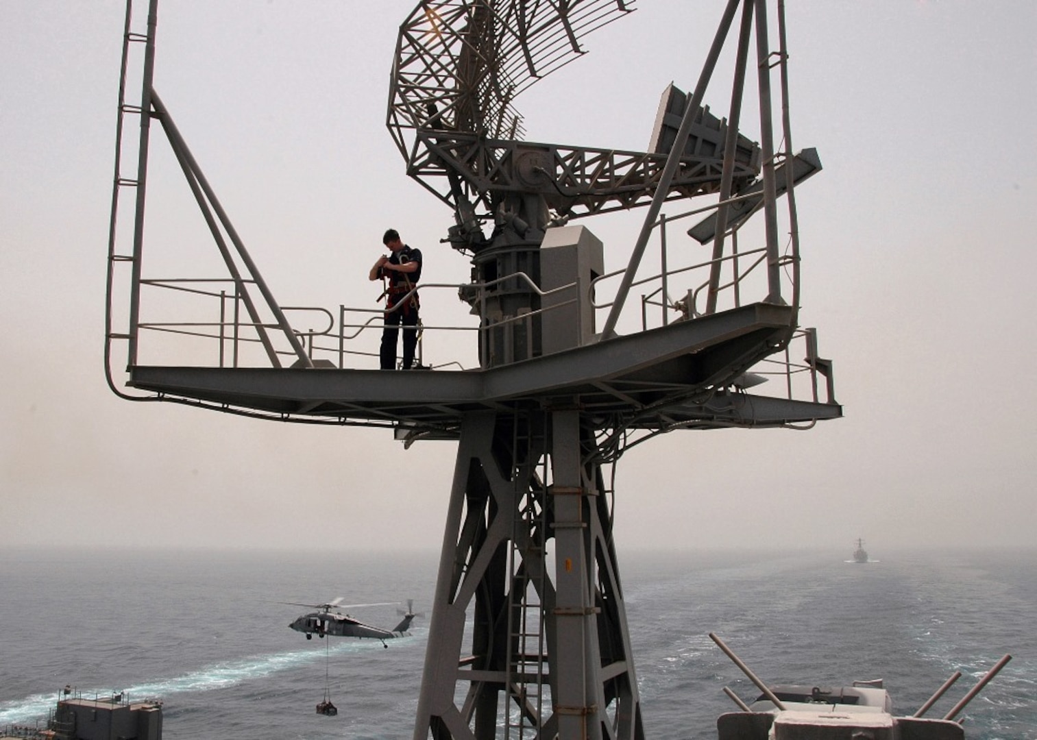 IMAGE: 080508-N-9450M-096  ARABIAN GULF (May 8, 2008)- ARABIAN GULF Electronics Technician 3rd Class Michael Isenmann prepares to work on an SPS-49 radar antenna aboard Nimitz-class aircraft carrier USS Abraham Lincoln (CVN 72).  Lincoln is deployed to the U.S. Navy 5th Fleet area of responsibility to support Maritime Security Operations (MSO).  MSO help develop security in the maritime environment, which promotes stability and global prosperity.  These operations complement the counterterrorism and security efforts of regional nations and seek to disrupt violent extremists' use of the maritime environment as a venue for attack or to transport personnel, weapons or other material.  U.S. Navy Photo by MC3 Johndion Magsipoc (Released).