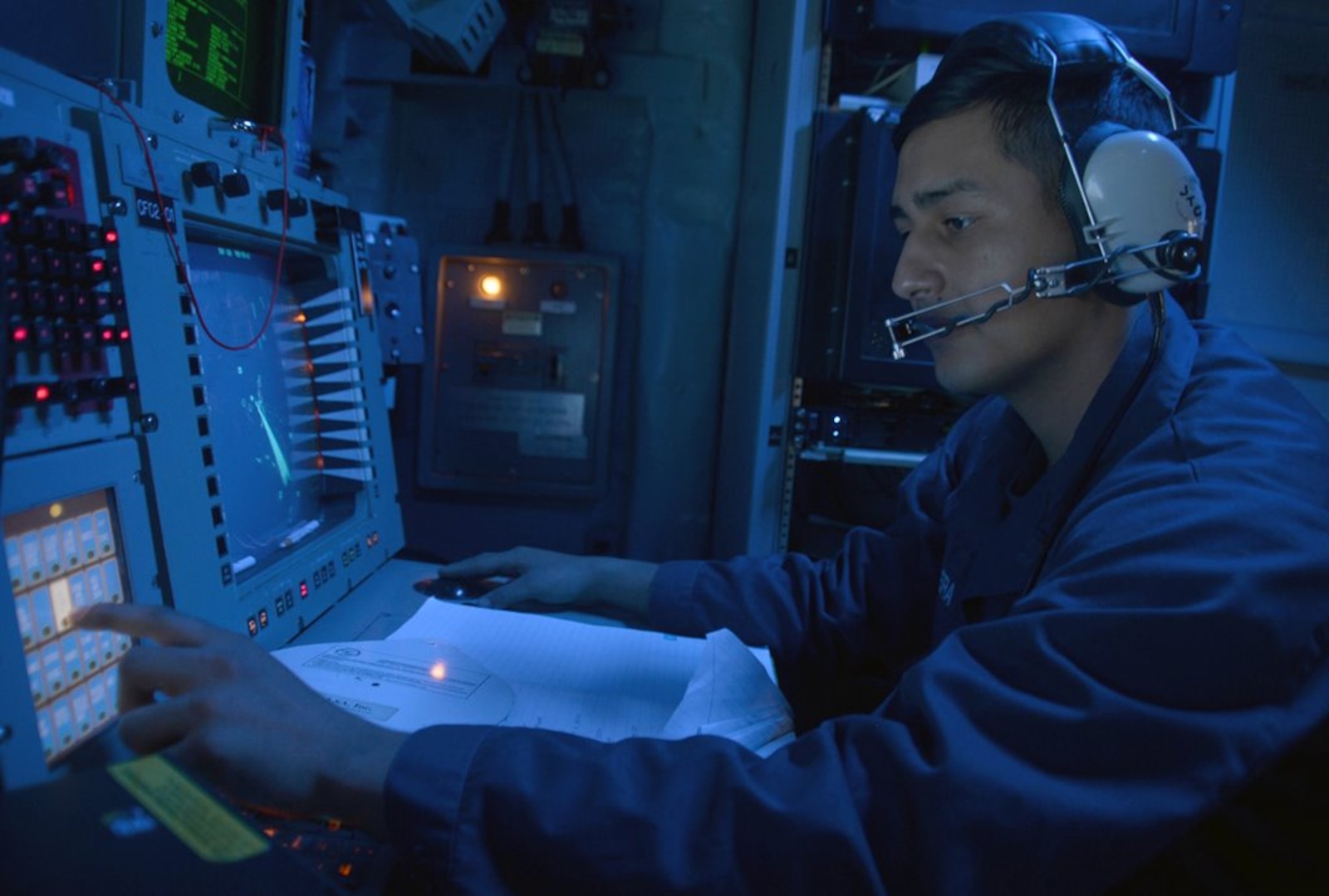 IMAGE: MEDITERRANEAN SEA - Cryptologic Technician (Technical) 2nd Class David J. Aguilera monitors the electromagnetic spectrum of air and surface contacts in the combat information center aboard the guided-missile destroyer USS Ramage (DDG 61). The Navy is refocusing efforts to deploy new electromagnetic maneuver warfare technologies under development for integration in the Fleet and its carrier strike groups, the Naval Surface Warfare Center Dahlgren Division announced, Nov. 1, 2017.