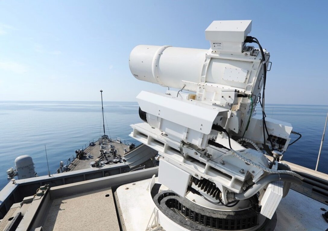 IMAGE: 141117-N-PO203-072 
ARABIAN GULF (Nov. 17, 2014) The Afloat Forward Staging Base (Interim) USS Ponce (ASB(I) 15) conducts an operational demonstration of the Office of Naval Research (ONR)-sponsored Laser Weapon System (LaWS) while deployed to the Arabian Gulf. (U.S. Navy photo by John F. Williams/Released)