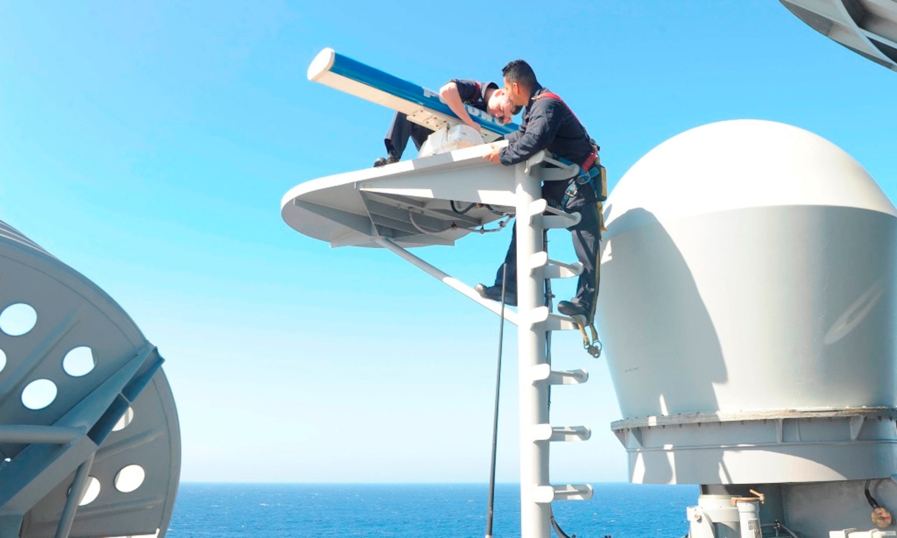 IMAGE: 160214-N-VD165-025 PACIFIC OCEAN (Feb. 14, 2016) Electronics Technician 2nd Class Andrew Wilson (left) and Electronics Technician 1st Class Josue Delgado perform maintenance on a Furuno commercial navigation radar aboard amphibious assault ship USS Boxer (LHD 4). More than 4,500 Sailors and Marines from Boxer Amphibious Ready Group and embarked 13th Marine Expeditionary Unit (13th MEU) are transiting the Pacific Ocean en route to the U.S. 5th and 7th Fleet areas of operations. (U. S. Navy photo by Mass Communication Specialist 2nd Class Jose Jaen/Released)