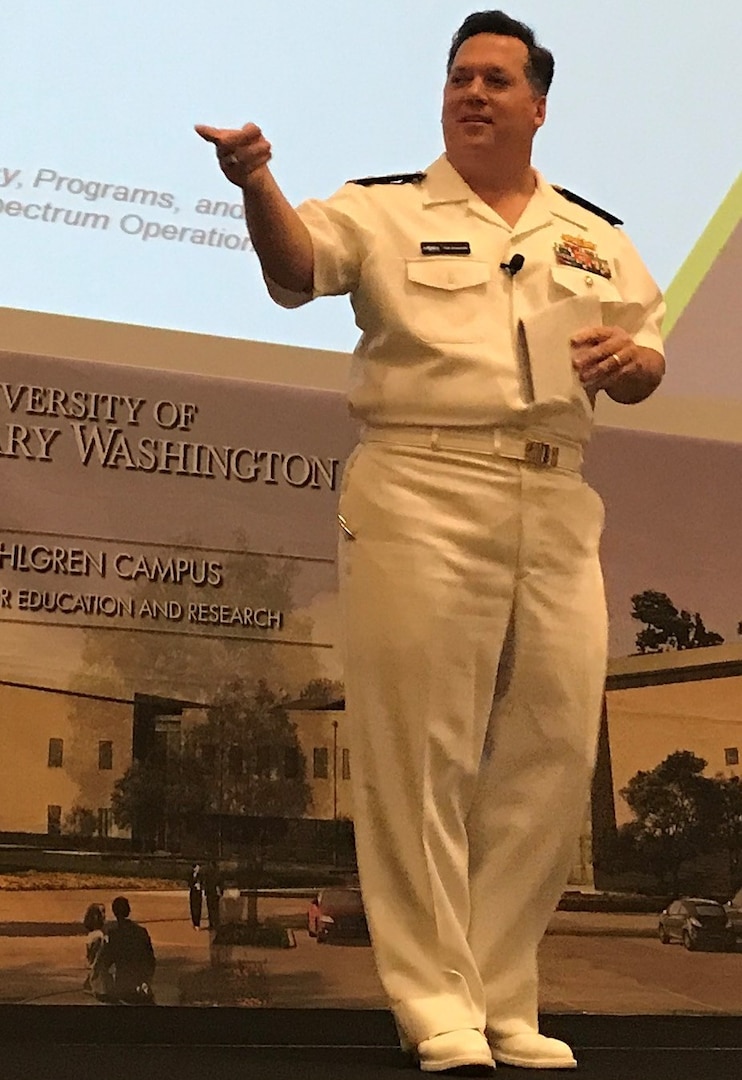 IMAGE: KING GEORGE, Va. (Sept. 26. 2017) – Naval Surface Warfare Center Commander Rear Adm. Tom Druggan tells the Electromagnetic Maneuver Warfare (EMW) Systems Engineering and Acquisition Conference audience that the Navy is renewing its focus on EMW for sea control and victory at sea. Industry, academia, and Department of Defense experts collaborated and discussed the advancement of electromagnetic warfare throughout the three-day event, sponsored by the Association of Old Crows and NSWC Dahlgren Division. (Courtesy photo by Shelley Frost/Released)