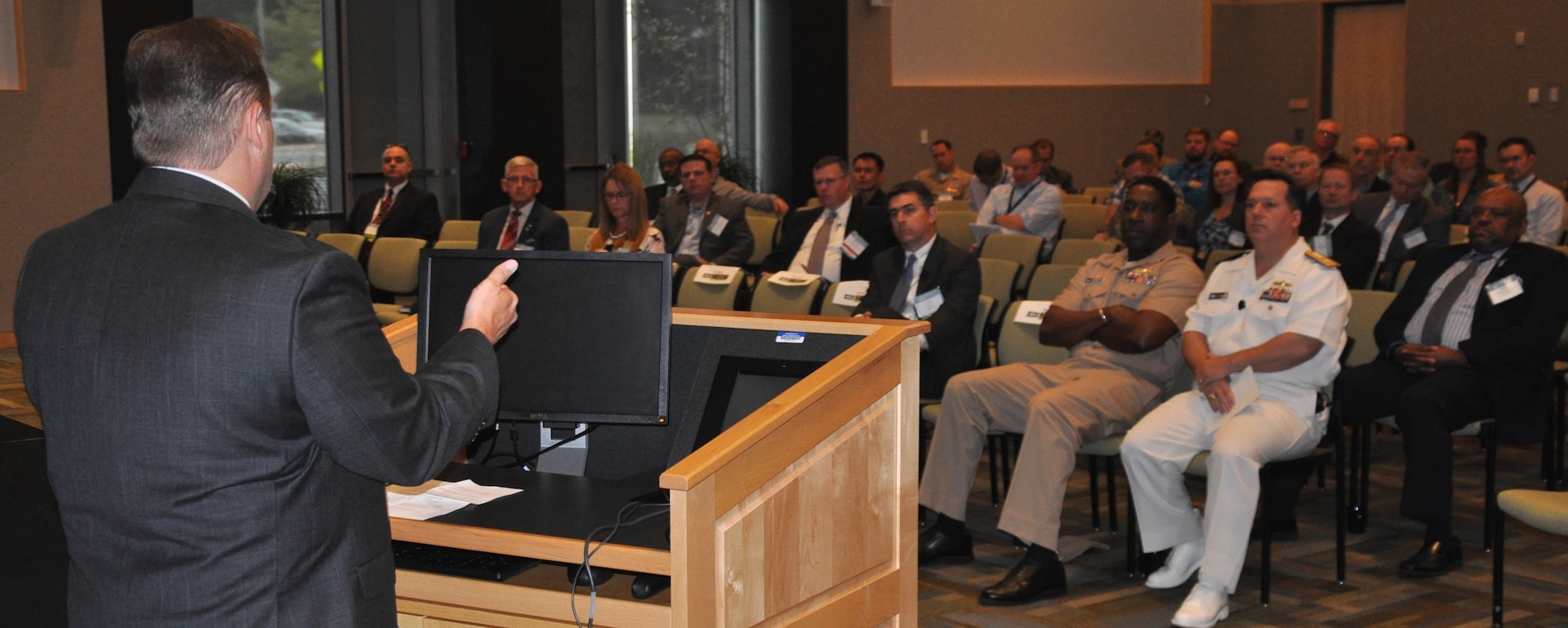 IMAGE: KING GEORGE, Va. (Sept. 26. 2017) – Dr. Marty Irvine - director of systems engineering at the Deputy Assistant Secretary of the Navy for Research, Development, Test and Evaluation - speaks during the Electromagnetic Maneuver Warfare (EMW) Systems Engineering and Acquisition Conference sponsored by the Association of Old Crows and Naval Surface Warfare Center Dahlgren Division (NSWCDD). Industry, academia, and Department of Defense experts discussed the advancement of electromagnetic warfare throughout the three-day event. Conference attendees toured NSWCDD labs and collaborated with the scientists and engineers behind the command's strategic thrusts and its electromagnetic and sensor systems technologies. NSWCDD strategic thrusts - electric weapons, mission engineering and analysis, and cyber warfare engineering – coupled with the command's technical expertise in the fields of spectrum management, electromagnetics, electronic warfare, and surface Navy radars are crucial to the Navy's development and integration of capabilities to enable EMW.  (U.S. Navy photo/Released)