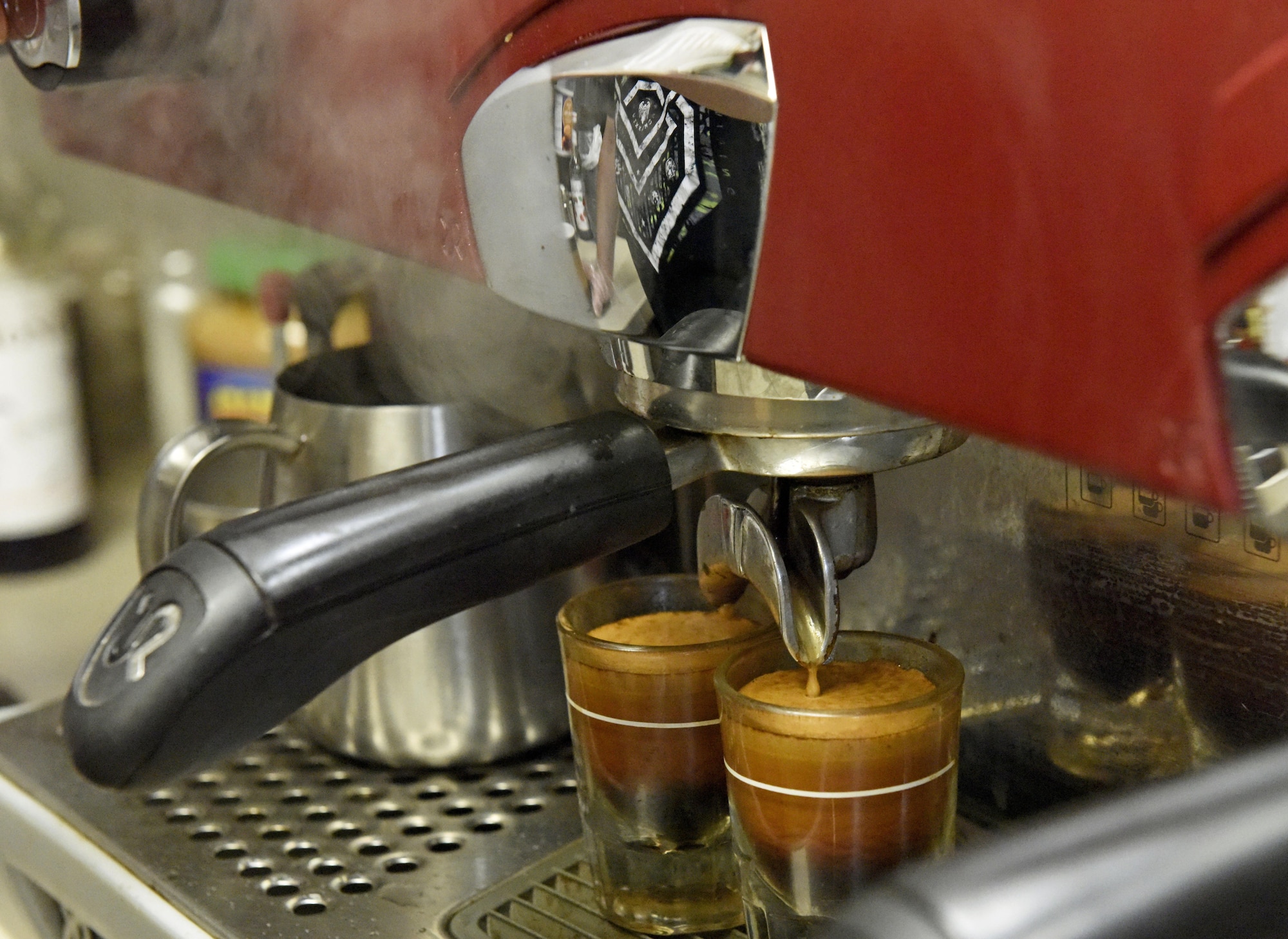 Larry Bowman, U.S. Air Force retiree and owner of the Coffee Corner, makes espresso shots at Fairchild Air Force Base, Wash., Sept. 26, 2017. Bowman sets his grinder to a specific coarseness, tamper that pushes the grinds with exactly 30 pounds of pressure, the espresso machine calibrated to give consistent shot every time at 198 degrees for the right amount of coffee at the proper grind, pressure and temperature can extract the optimal amount of oils, caffeine and flavor out of each coffee bean. (U.S. Air Force photo/Airman 1st Class Jesenia Landaverde)