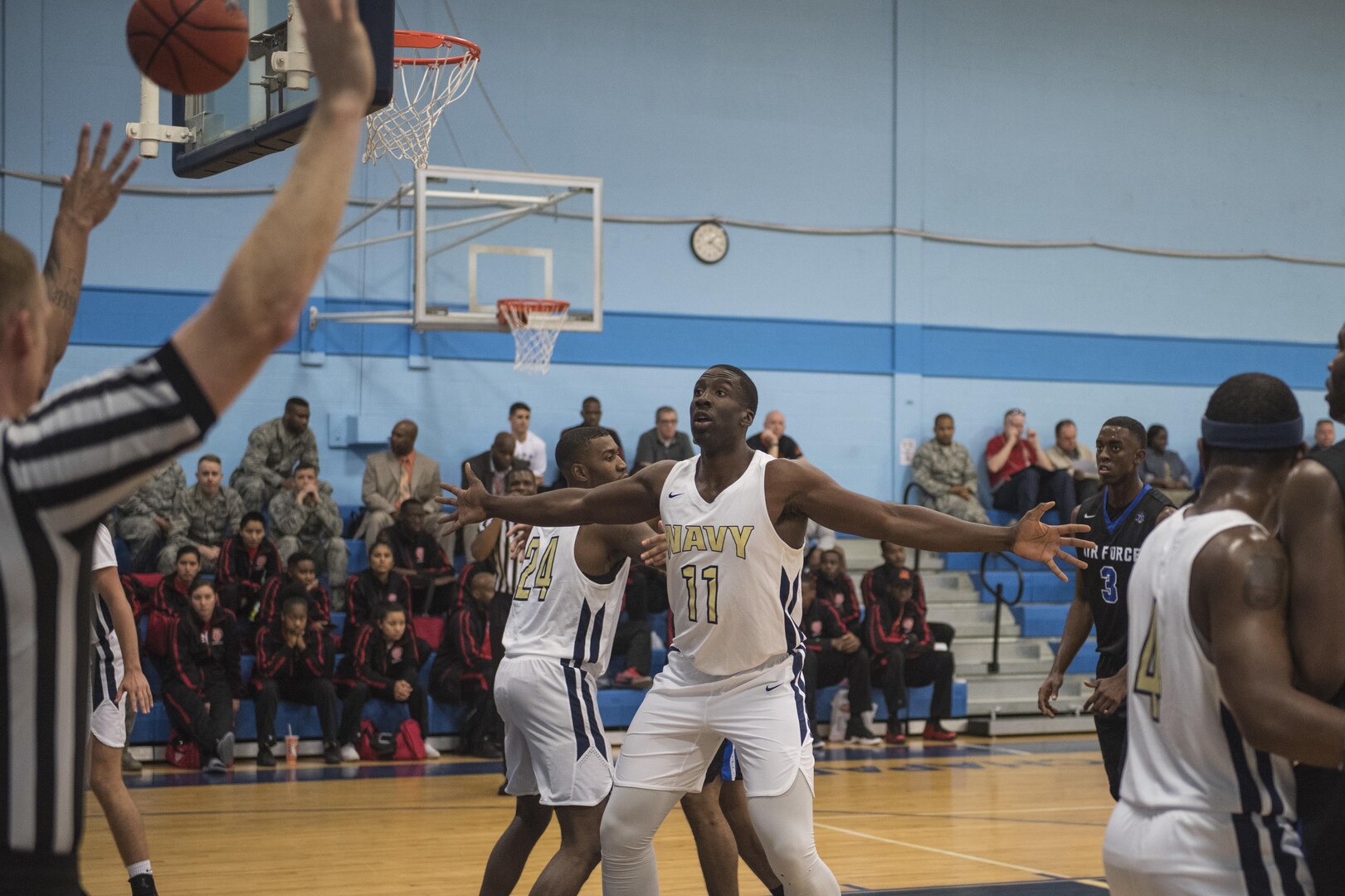 SAN ANTONIO (Nov. 01, 2017) - Seaman Larry Okhomina, assigned to Nimitz-class aircraft carrier USS Abraham Lincoln (CVN 72) blocks a player from passing during a basketball game. The 2017 Armed Forces Basketball Championship is held at Joint Base San Antonio Lackland Air Force Base from 1-7 November. The best two teams during the double round robin will face each other for the 2017 Armed Forces crown. (U.S. Navy photo by Mass Communication Specialist 2nd Class Emiline L. M. Senn/Released)