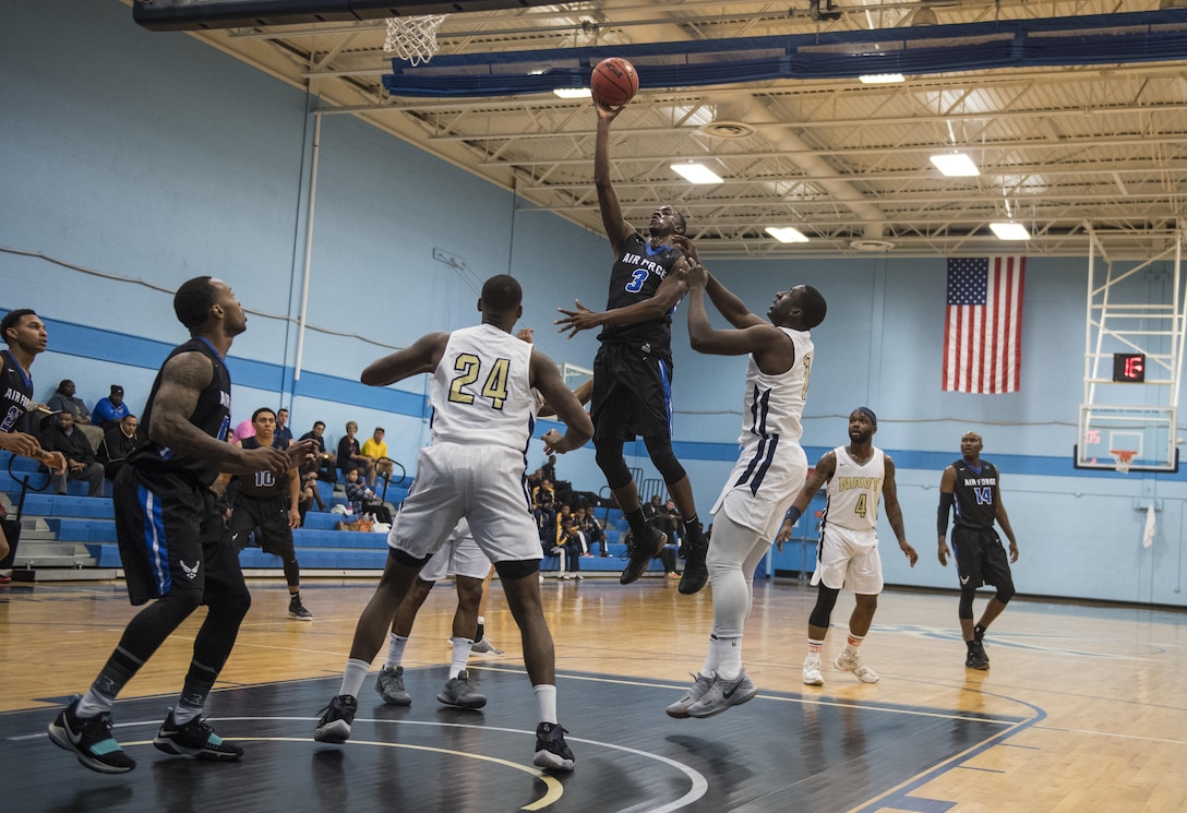 SAN ANTONIO (Nov. 01, 2017) - United States Air Force 1st Lt. Justin Hammonds, assigned to March Air Force Base attempts to score during a basketball game. The 2017 Armed Forces Basketball Championship is held at Joint Base San Antonio, Lackland Air Force Base from 1-7 November. The best two teams during the double round robin will face each other for the 2017 Armed Forces crown. (U.S. Navy photo by Mass Communication Specialist 2nd Class Emiline L. M. Senn/Released)