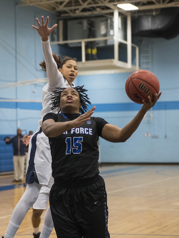 SAN ANTONIO (Nov. 01, 2017) - Airman 1st Class Giovanni Sims, assigned to Davis-Monthan Air Force Base attempts to score during a basketball game. The 2017 Armed Forces Basketball Championship is held at Joint Base San Antonio, Lackland Air Force Base from 1-7 November. The best two teams during the double round robin will face each other for the 2017 Armed Forces crown. (U.S. Navy photo by Mass Communication Specialist 2nd Class Emiline L. M. Senn/Released)