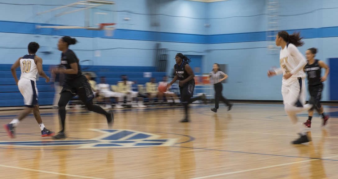 SAN ANTONIO (Nov. 01, 2017) - United States Air Force Staff Sgt. Charmaine Clark, assigned to Robins Air Force Base drives down the court during a basketball game. The 2017 Armed Forces Basketball Championship is held at Joint Base San Antonio, Lackland Air Force Base from 1-7 November. The best two teams during the double round robin will face each other for the 2017 Armed Forces crown. (U.S. Navy photo by Mass Communication Specialist 2nd Class Emiline L. M. Senn/Released)