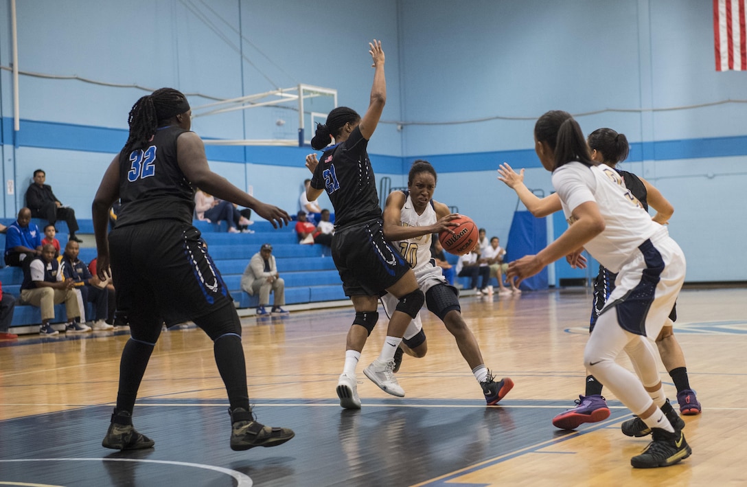 SAN ANTONIO (Nov. 01, 2017) -Petty Officer 2nd Class Nyesha Adams, assigned to Naval War College, Newport, attempts to drive down the court during a basketball game. The 2017 Armed Forces Basketball Championship is held at Joint Base San Antonio, Lackland Air Force Base from 1-7 November. The best two teams during the double round robin will face each other for the 2017 Armed Forces crown. (U.S. Navy photo by Mass Communication Specialist 2nd Class Emiline L. M. Senn/Released)