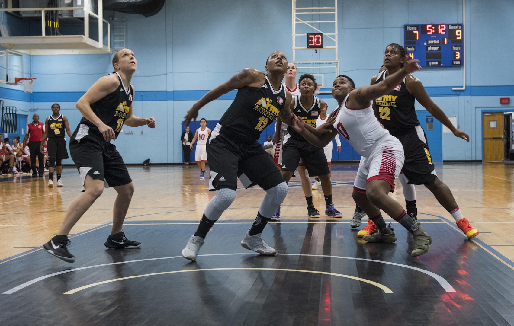 SAN ANTONIO (Nov. 01, 2017) - Members from the Marine and Army Women's basketball teams attempt to rebound a free throw during a basketball game. The 2017 Armed Forces Basketball Championship is held at Joint Base San Antonio, Lackland Air Force Base from 1-7 November. The best two teams during the double round robin will face each other for the 2017 Armed Forces crown. (U.S. Navy photo by Mass Communication Specialist 2nd Class Emiline L. M. Senn/Released)